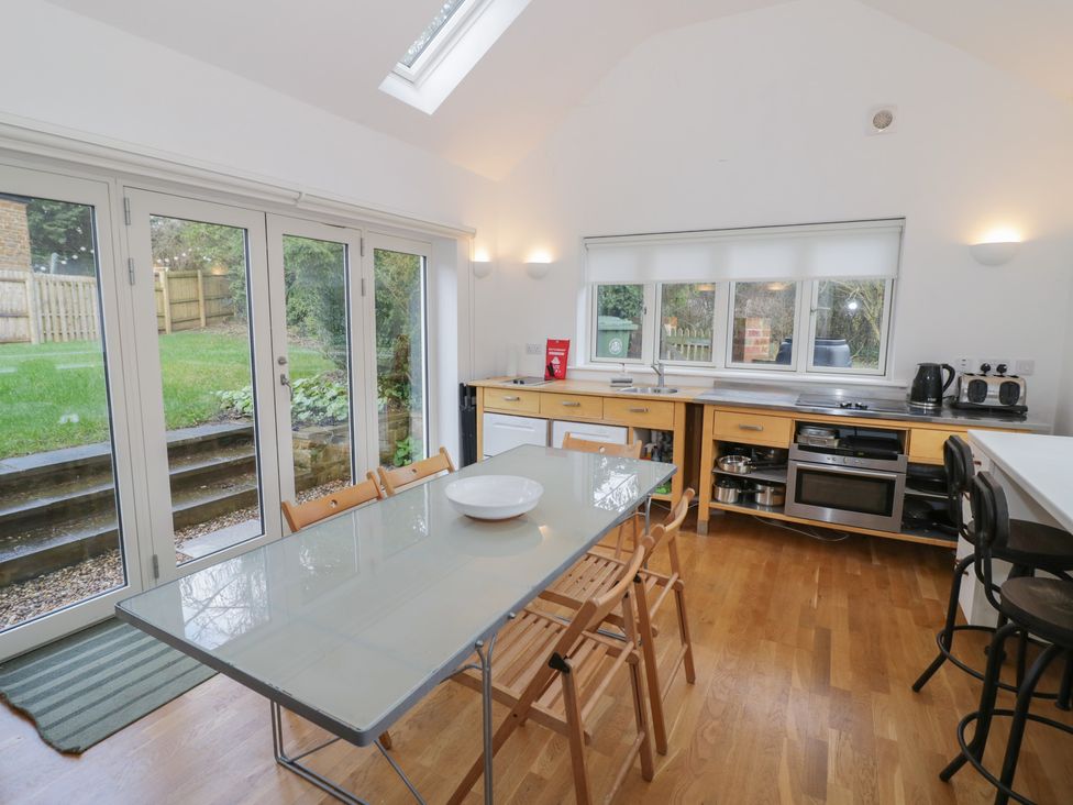 A kitchen with a table and chairs at Ambercote Priors Marston near Southam
