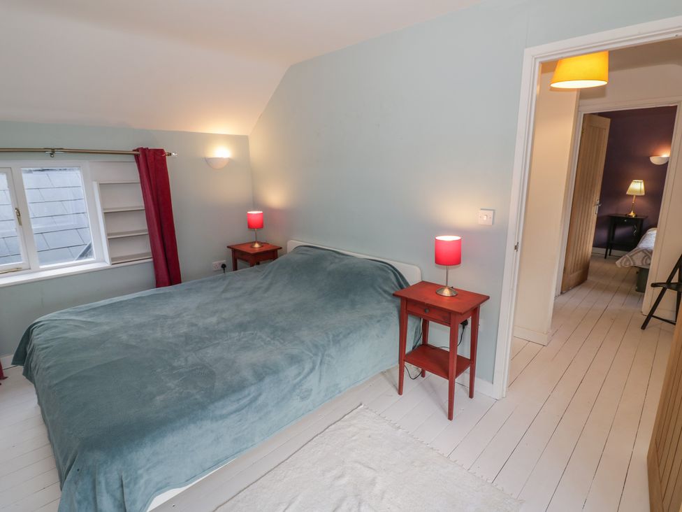 A bedroom with a bed and nightstand at Ambercote in Priors Marston near Southam