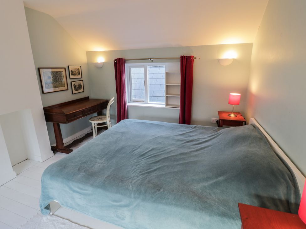 A bedroom with a bed and desk at Ambercote Priors Marston near Southam