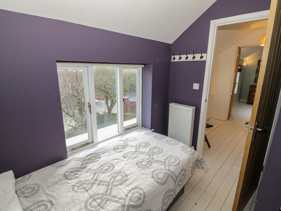 A bedroom with a bed and window at Ambercote Priors Marston near Southam