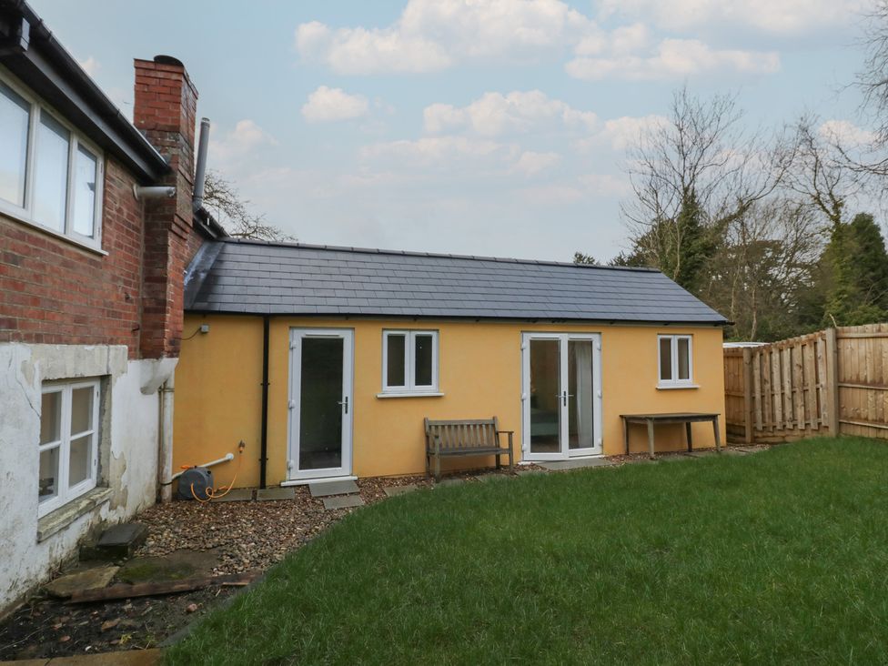 A house with a yellow exterior and garden at Ambercote Priors Marston near Southam