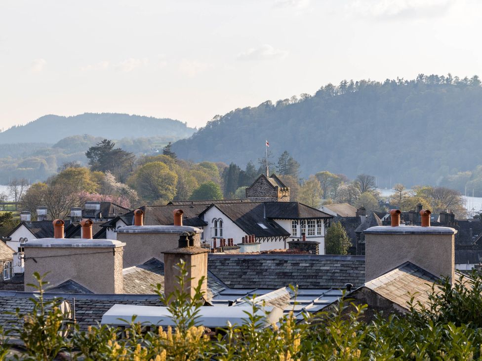 A view of rooftops and mountains at Luxury 2 Bed Room Lake View Apt Bowness Parking Bowness-On-Windermere