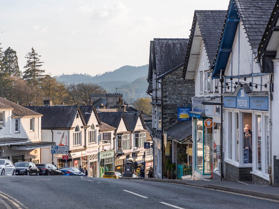 A street with shops and houses at Luxury 2 Bed Room Lake View Apt Bowness Parking in Bowness-On-Windermere