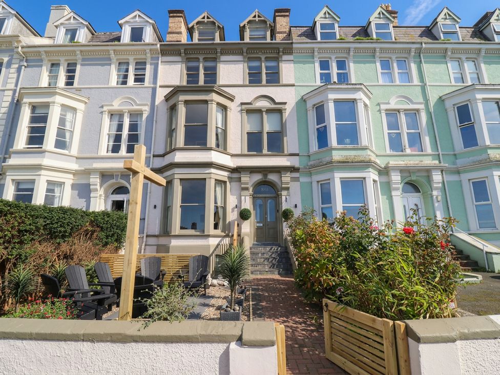 An outdoor area with a building facade and plants at Sea View, East Parade in Llandudno