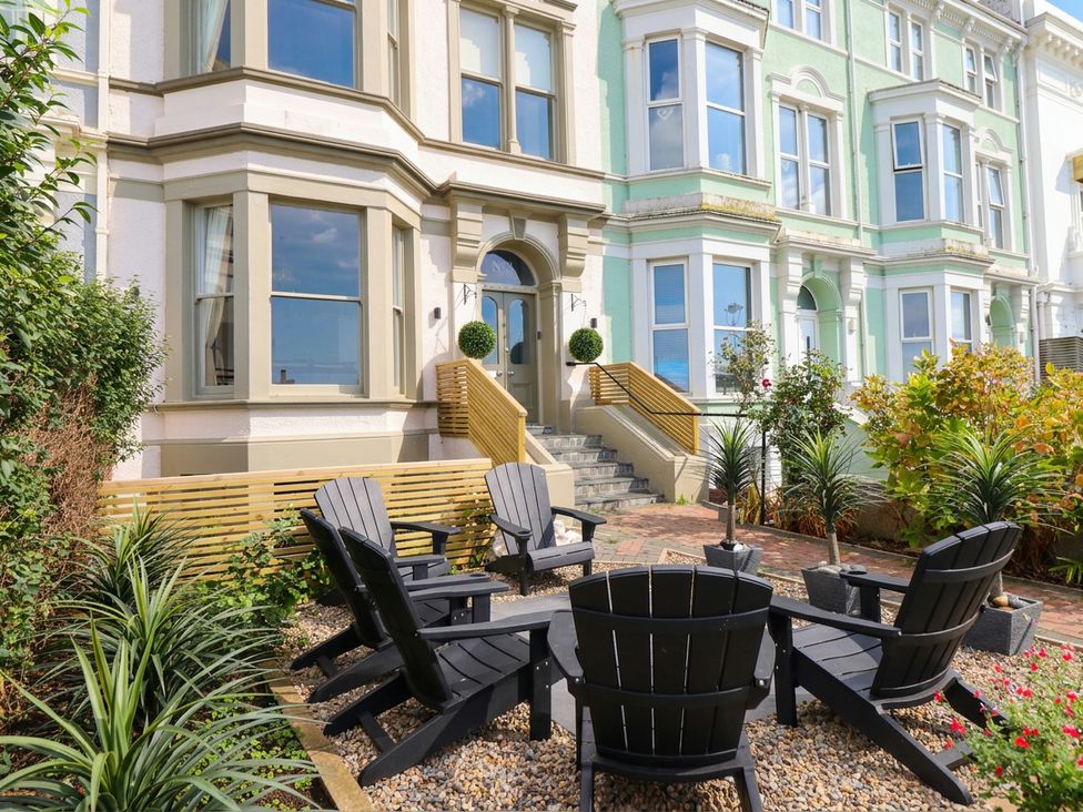 A garden with seating and plants at Sea View, East Parade, Llandudno