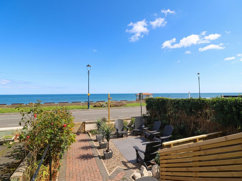 An outdoor seating area overlooking the sea at Sea View, East Parade in Llandudno