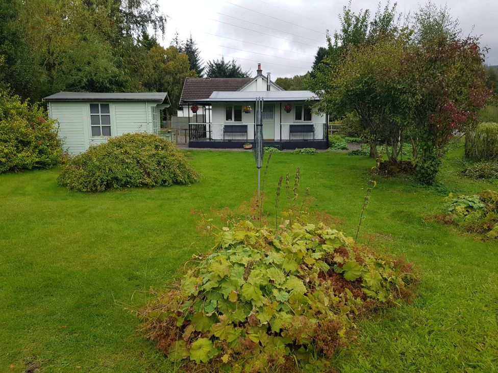 A house with a garden and a shed at River View Cottage Sleeps 6 - Garden, Bbq, Parking, Pitlochry