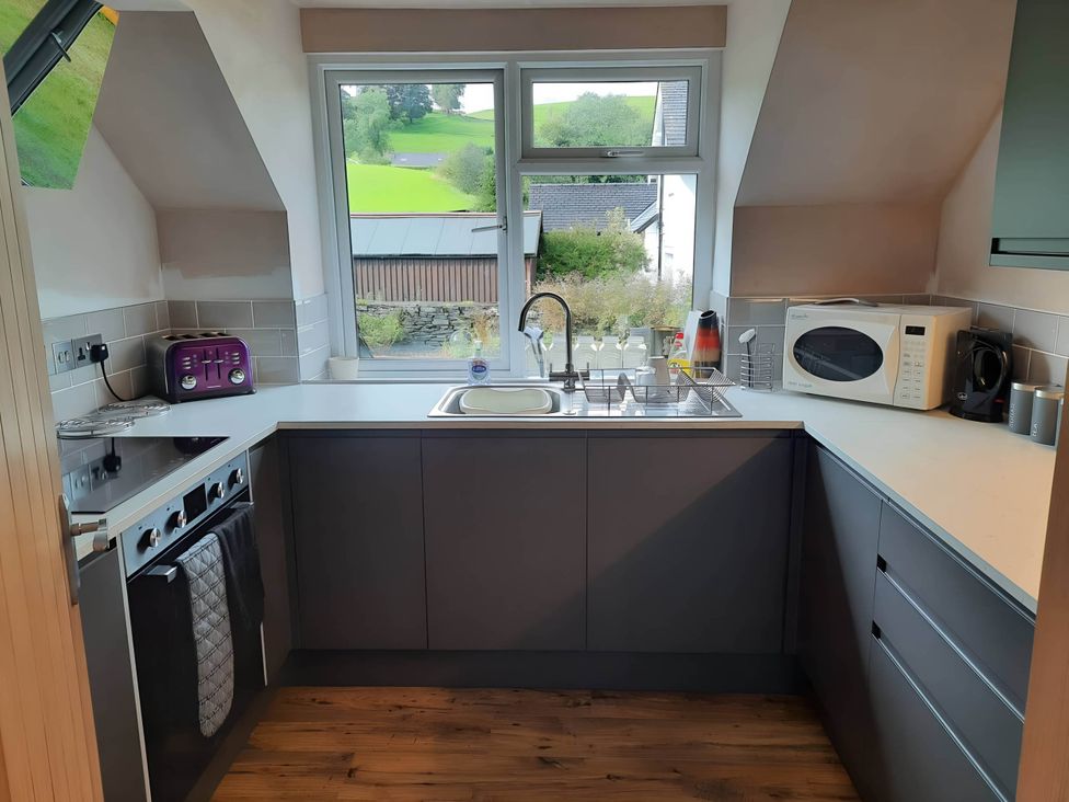 A kitchen with a sink and stove at 3 Bed Barn - Sleeps 6 - Parking - Wifi, Hawkshead