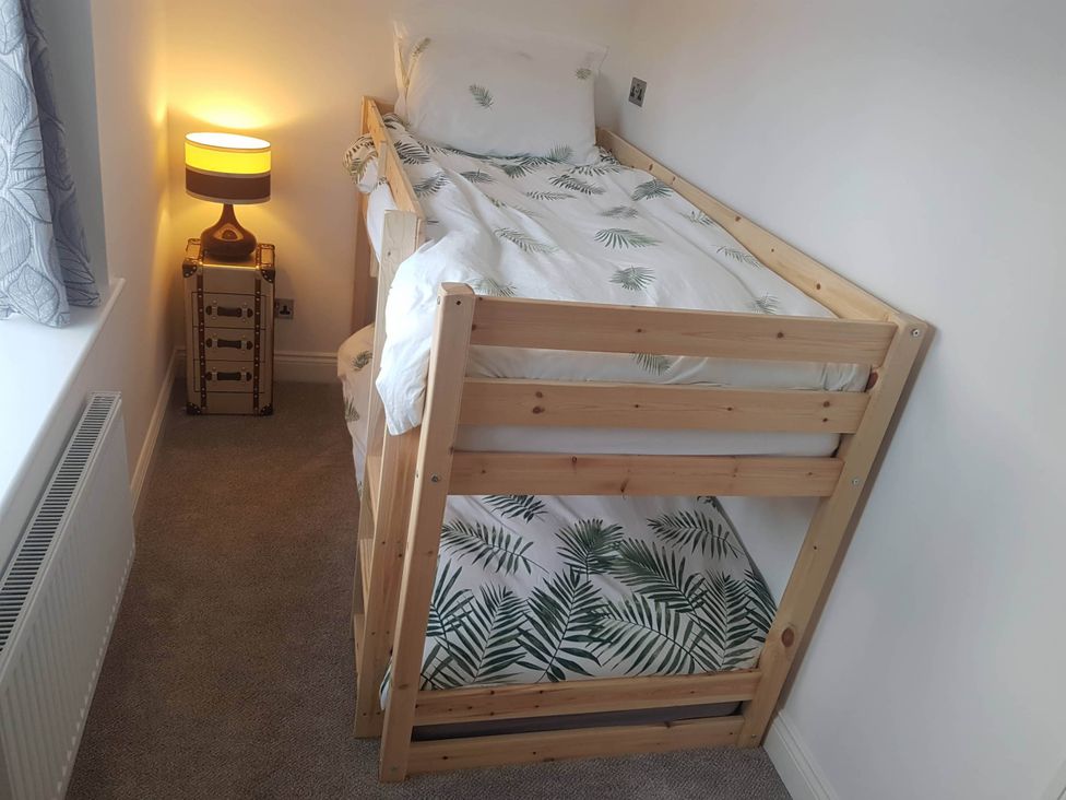 A bedroom with a loft bed and a lamp at 3 Bed Barn - Sleeps 6 - Parking - Wifi, Hawkshead
