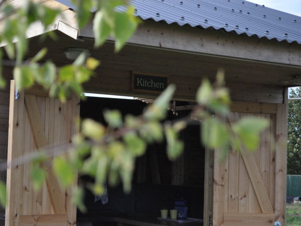 A kitchen entrance with a sign at Restored circus wagon Saltburn-By-The-Sea