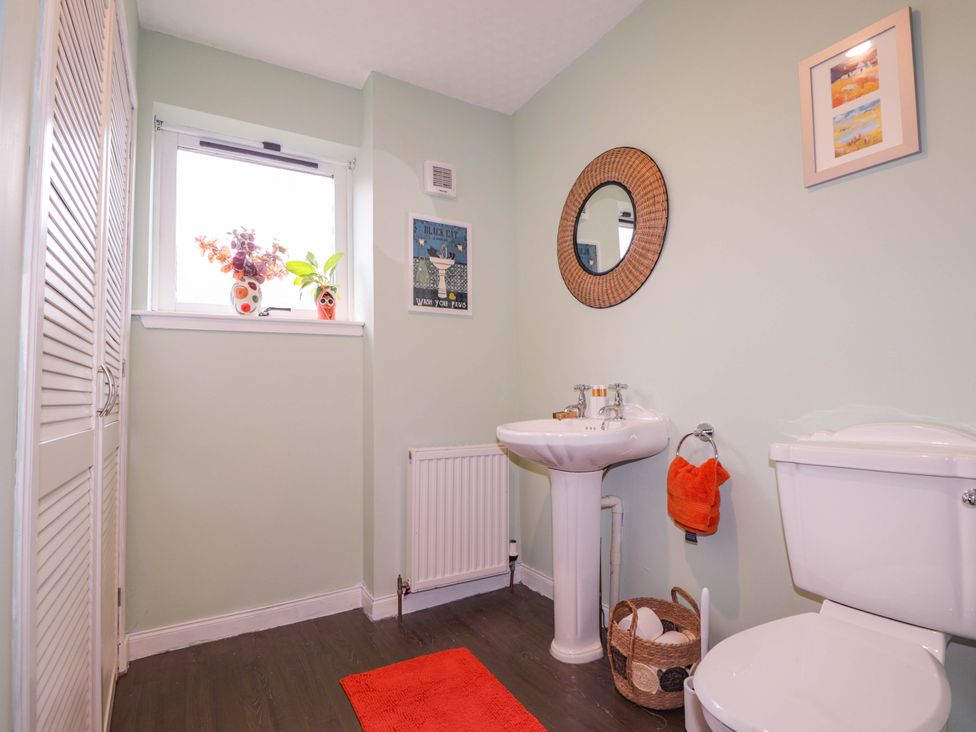 A bathroom with a sink and toilet at Dunhallin House in Inverness