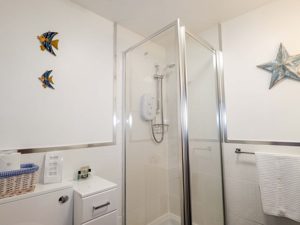 A bathroom with a shower and toilet at Dunhallin House in Inverness