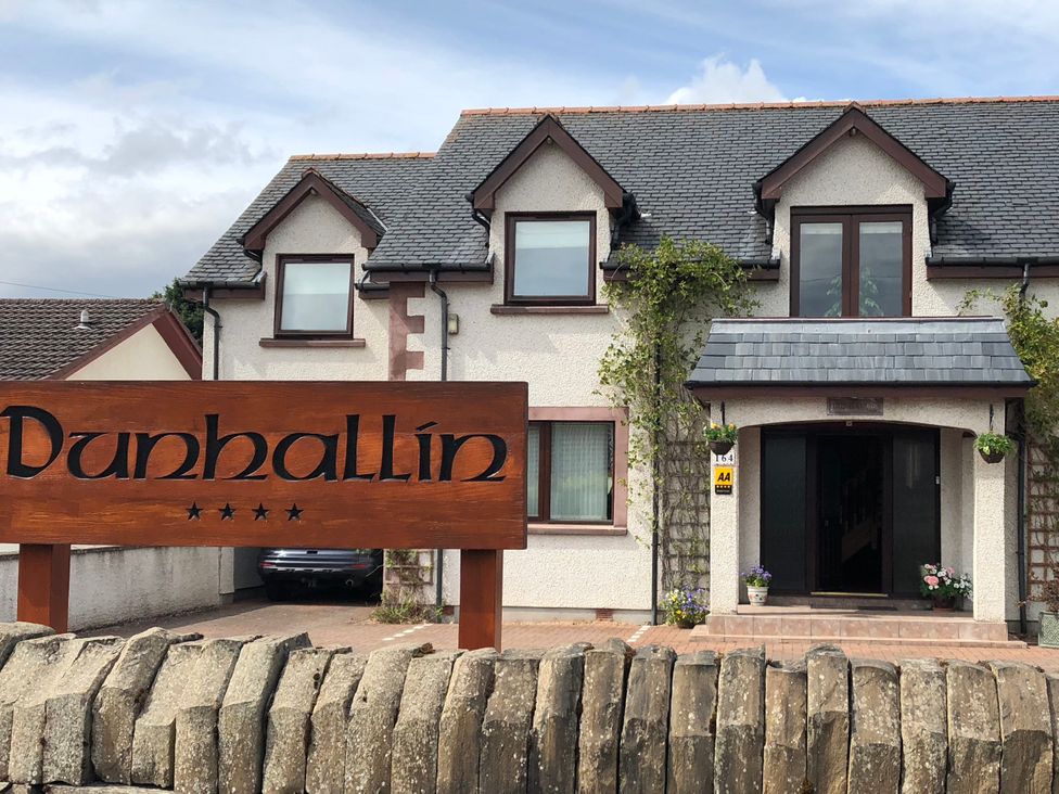 A building with a sign at Dunhallin House in Inverness