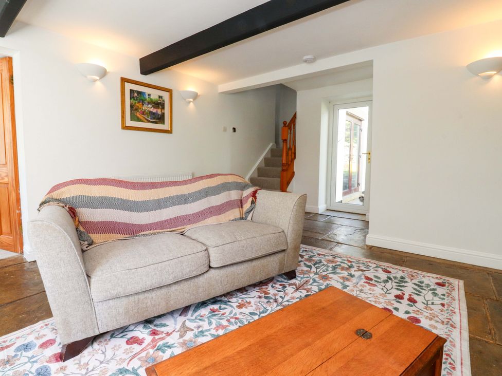 A living room with a sofa and coffee table at 6 Hazel Moor Blackburn