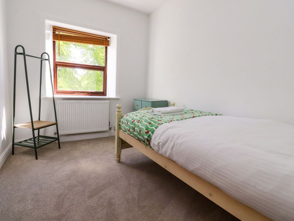 A bedroom with a bed and a window at 6 Hazel Moor Blackburn