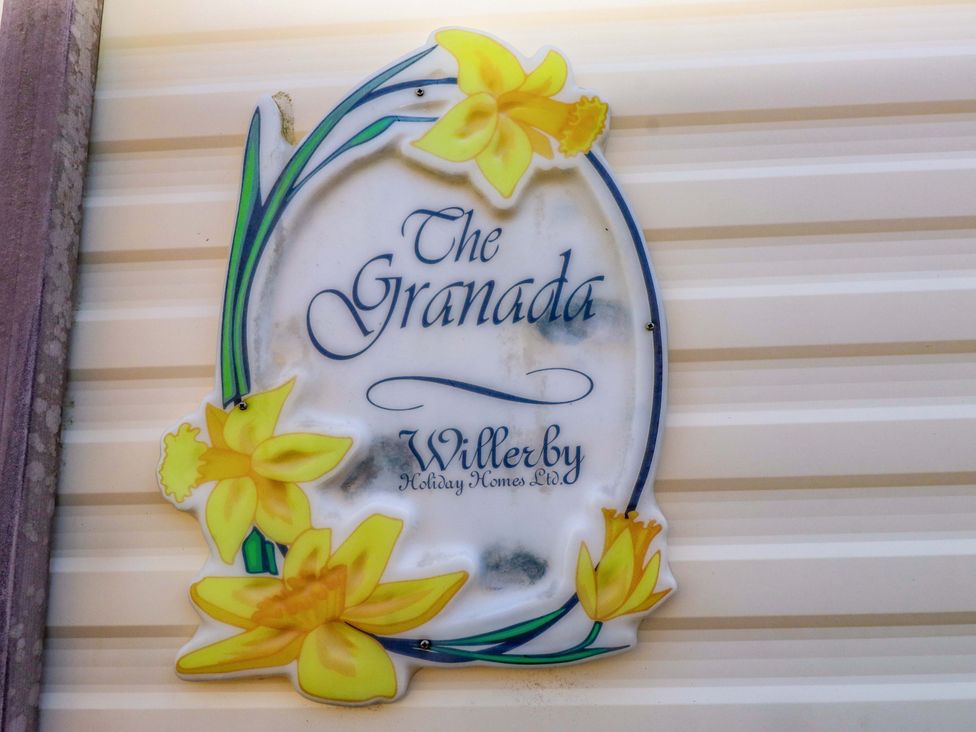 A sign for The Granada by Willerby at Caravan at Argraig Llanrhyddlad near Cemaes Bay