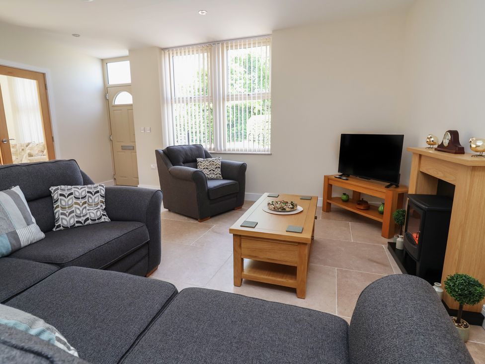 A living room with a sofa and coffee table at Naseby House Morton near Alfreton