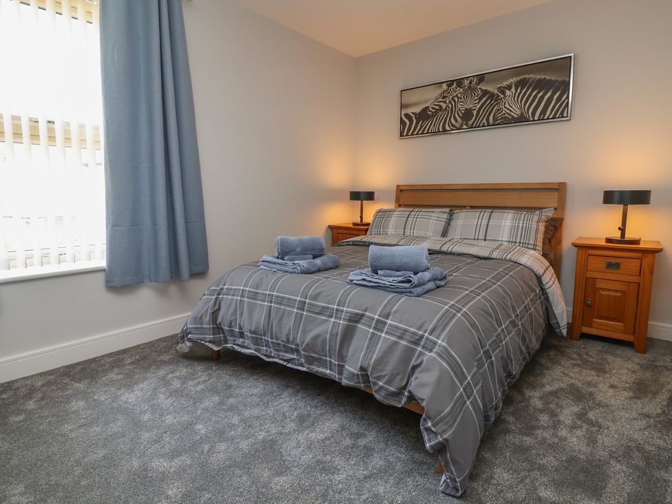 A bedroom with a bed and bedside tables at Naseby House in Morton near Alfreton