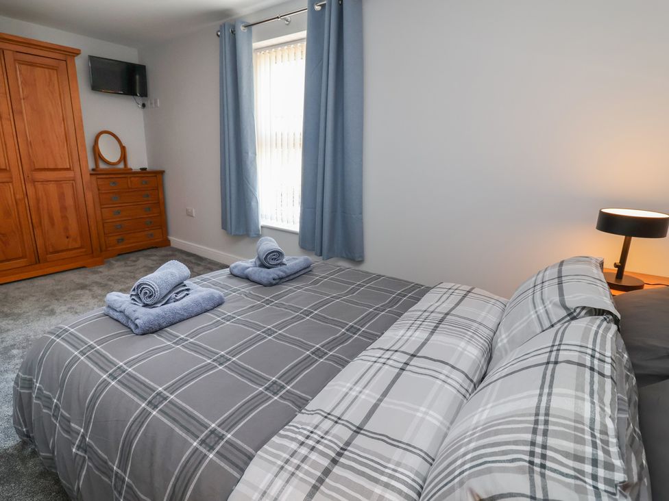 A bedroom with a bed and furniture at Naseby House Morton near Alfreton