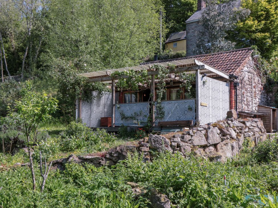 A house with a patio and a garden at Ferryman's Lodge in Brockweir