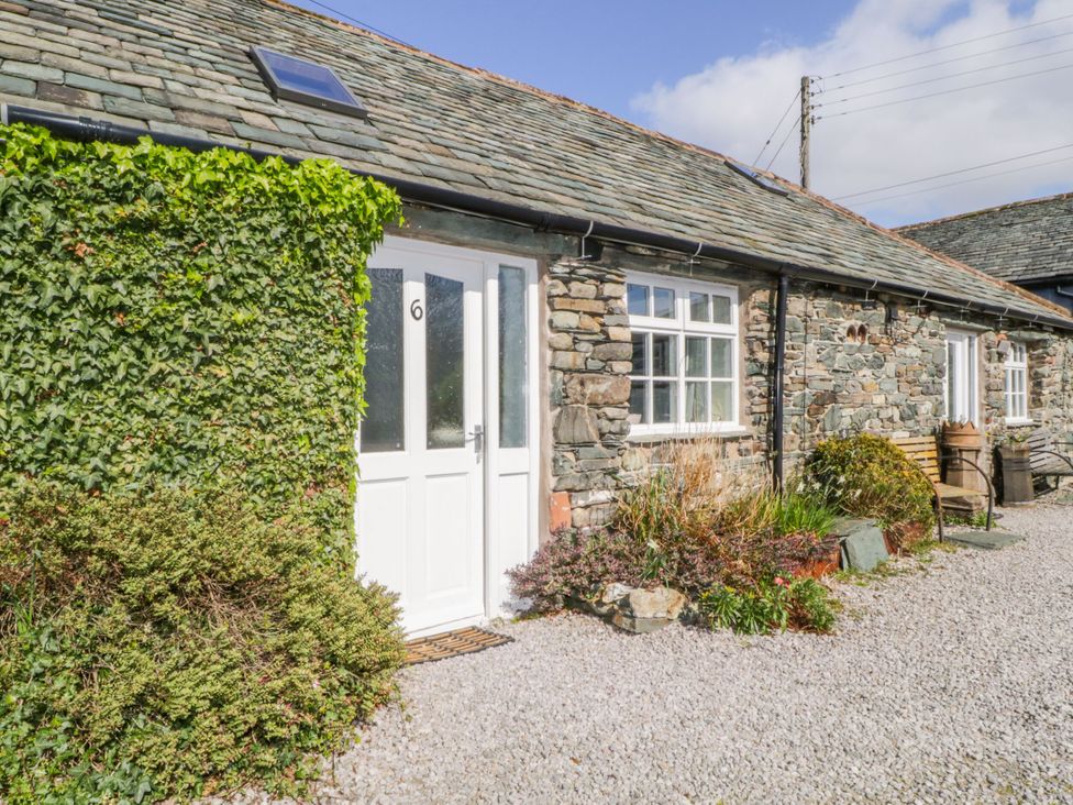 An entrance with a door and windows at Mews Cottage 6 Keswick