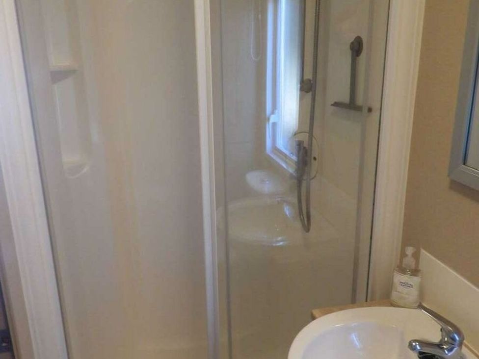 A bathroom with a shower and a sink at Lifes A Beach in Holt