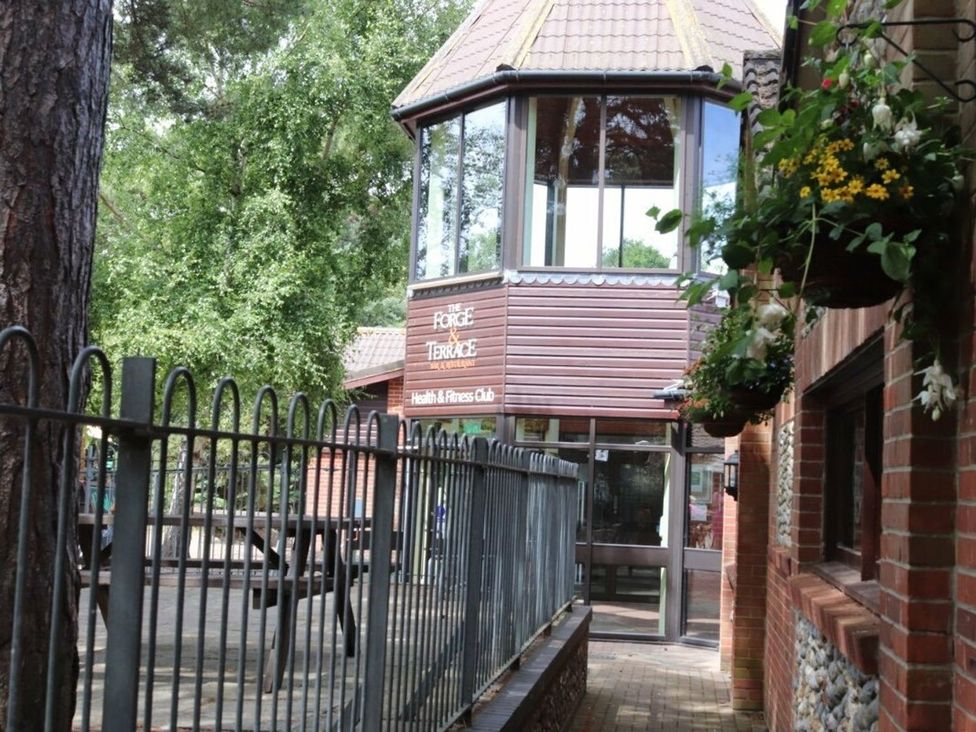 An entrance to a health and fitness club with outdoor seating at Living The Dream in Holt