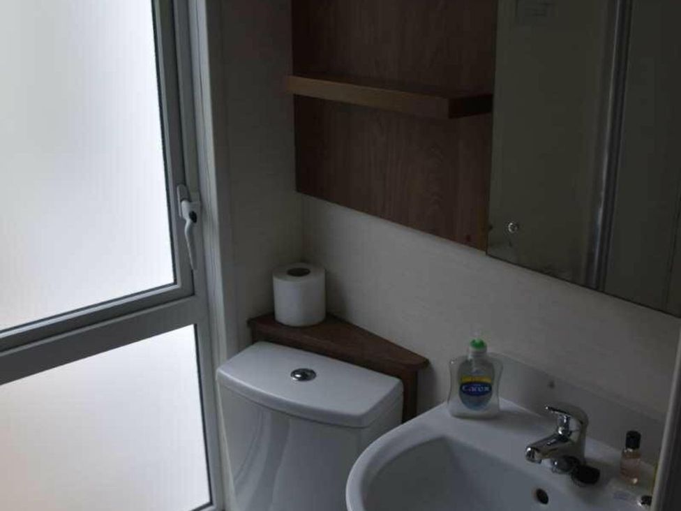 A bathroom with a toilet and sink at Another Day In Paradise Holt