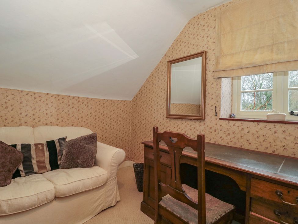An office with a desk and a sofa at Tuxwell Lodge Spaxton near Nether Stowey