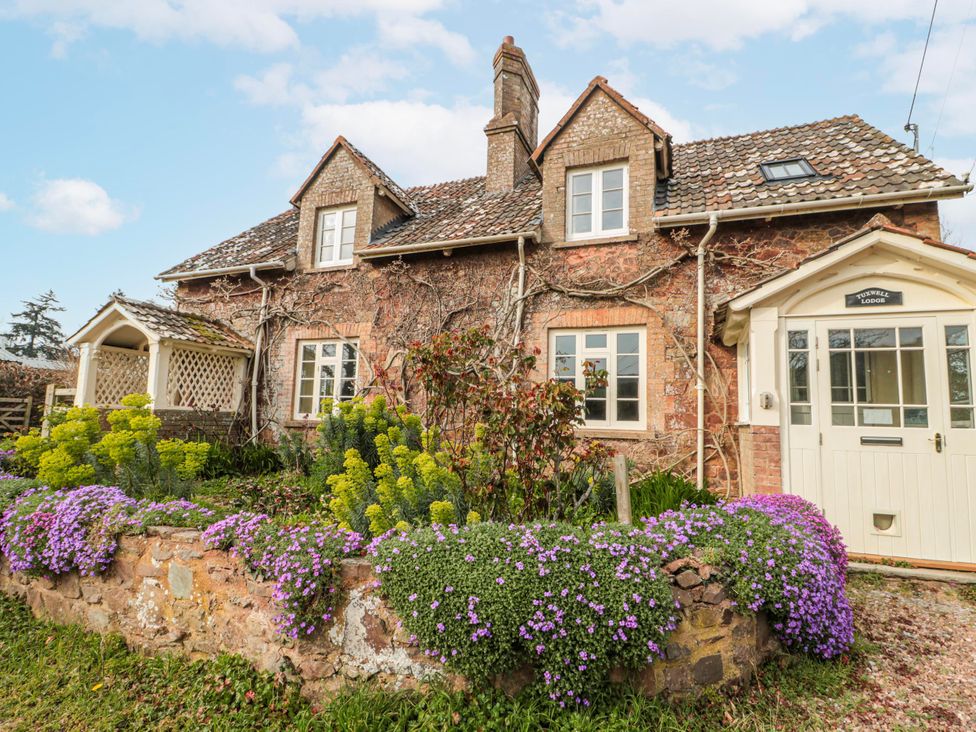 A house with garden and flowers at Tuxwell Lodge near Nether Stowey