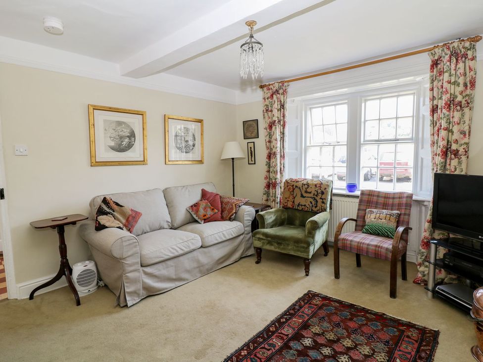 A living room with a sofa and armchairs at Ivy Cottage in Hartington