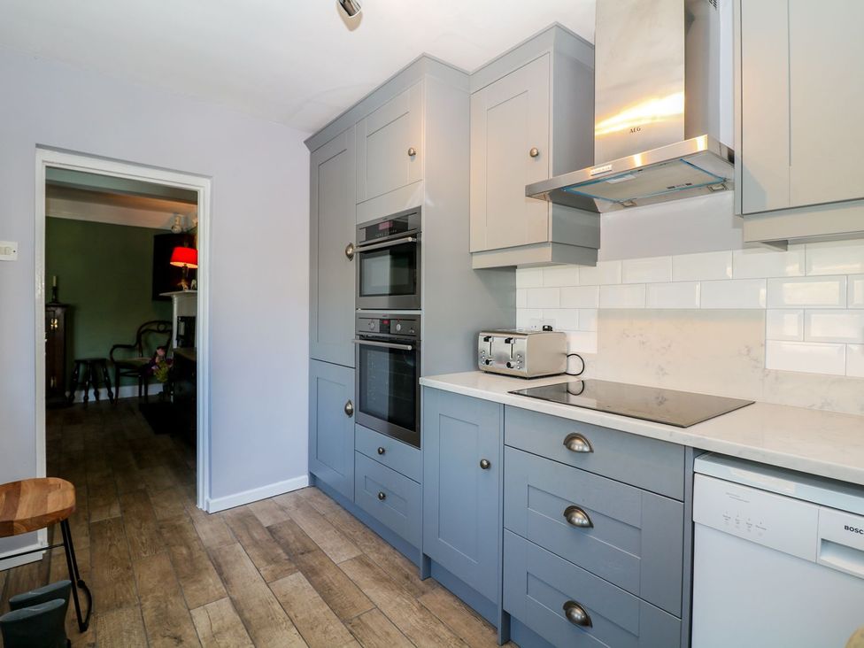 A kitchen with two ovens and a toaster at Ivy Cottage Hartington