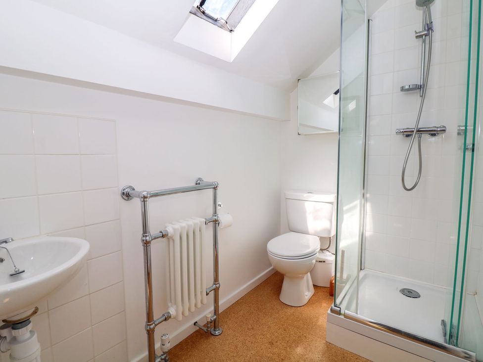 A bathroom with a shower and toilet at Ivy Cottage Hartington