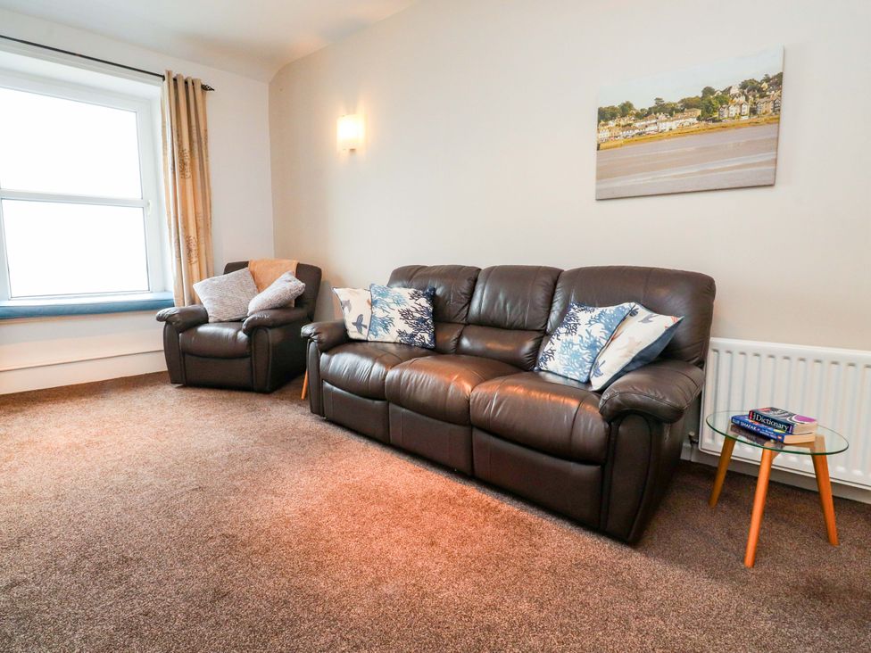 A living room with a sofa and armchair at Flat 2, Dorstan in Carnforth