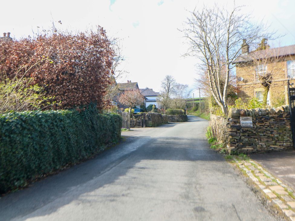 A street with houses and trees at Glenside Lodge in Chapel-En-Le-Frith