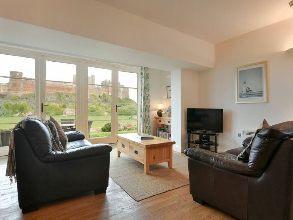 A living room with a sofa and coffee table at Northrawe in Bamburgh