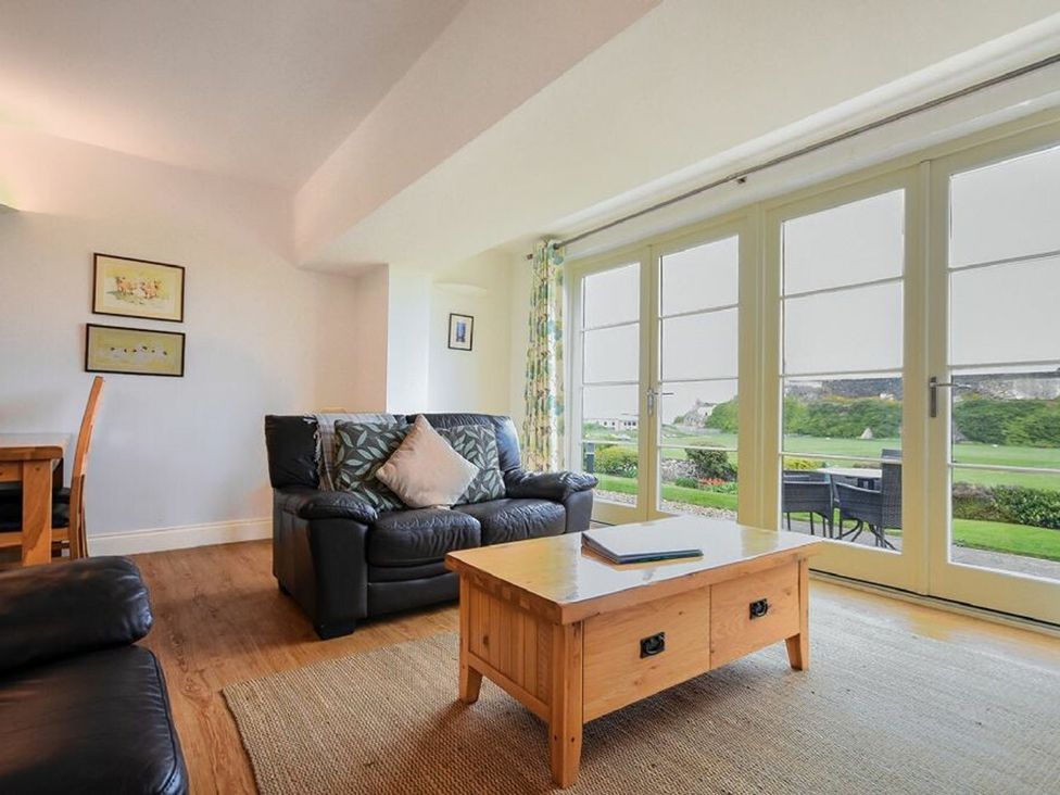 A living room with a sofa and coffee table at Northrawe in Bamburgh
