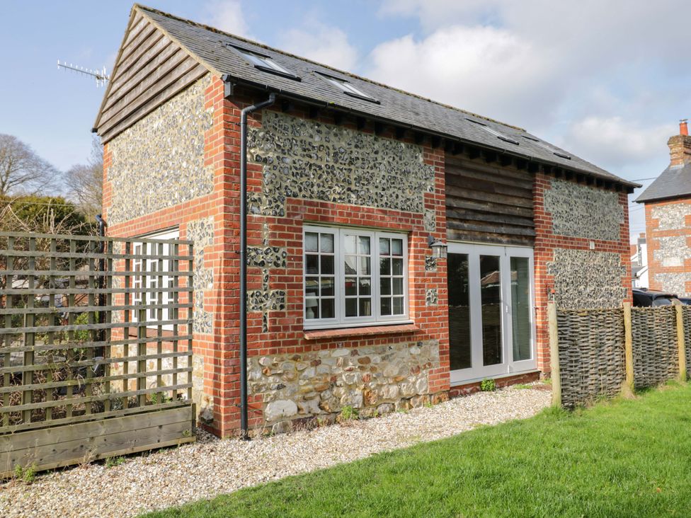 A building with windows and a garden at The Barn at Myrtle Cottage