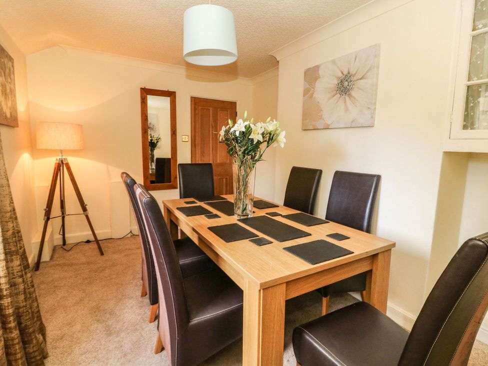 A dining room with a table and chairs at Blacksmiths Retreat in York
