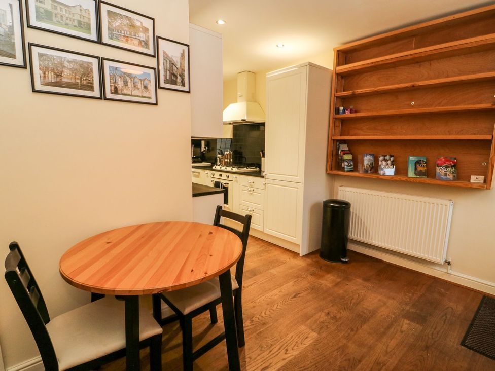 A kitchen with a table and chairs at Blacksmiths Retreat in York