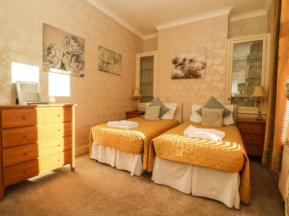 A bedroom with two beds and a dresser at Blacksmiths Retreat in York
