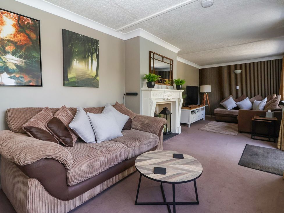 A living room with a sofa and coffee table at Blacksmith Mews in York