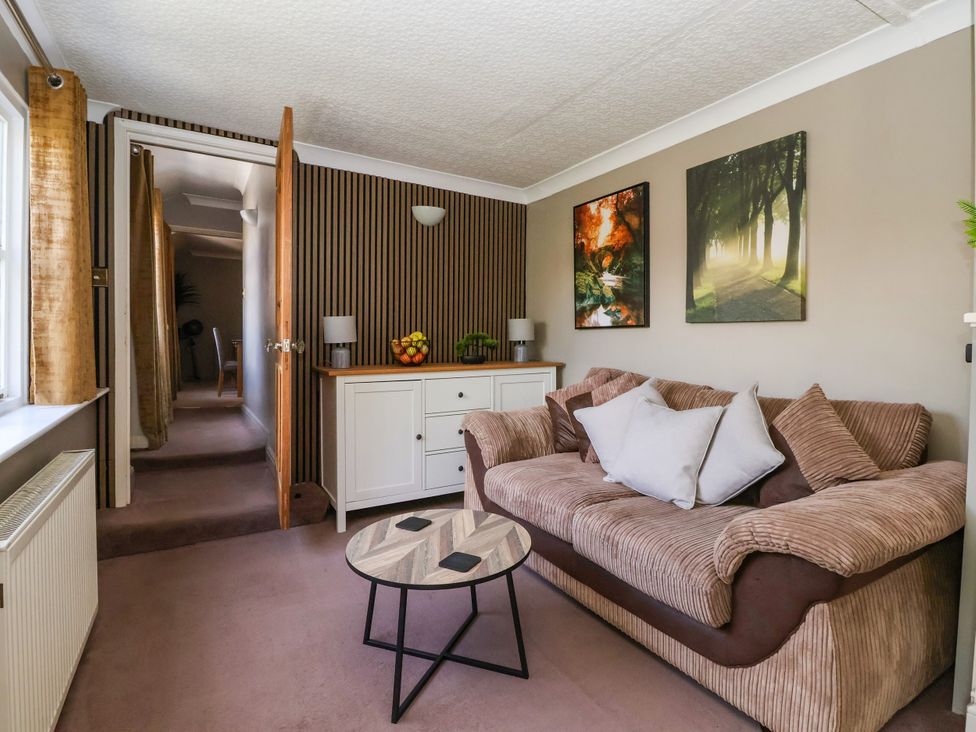 A snug with a sofa and coffee table at Blacksmith Mews in York