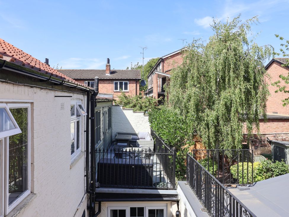 An outdoor area with buildings and a tree at Blacksmith Mews in York