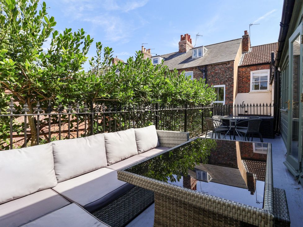 A patio with seating and a table at Blacksmith Mews in York