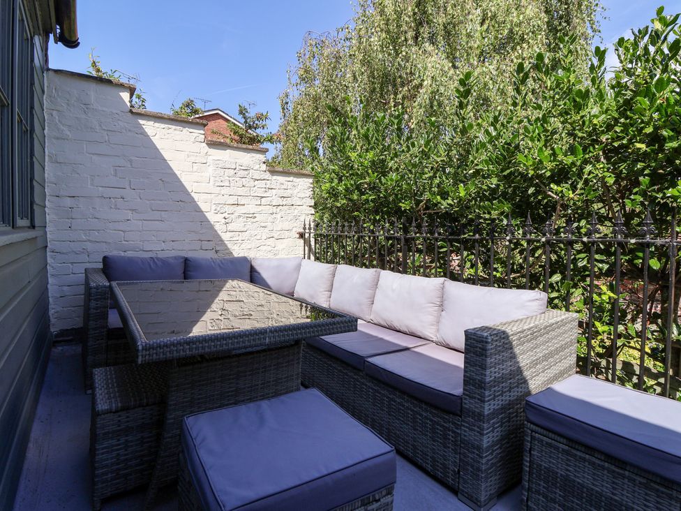 An outdoor seating area with a table and a sofa at Blacksmith Mews in York