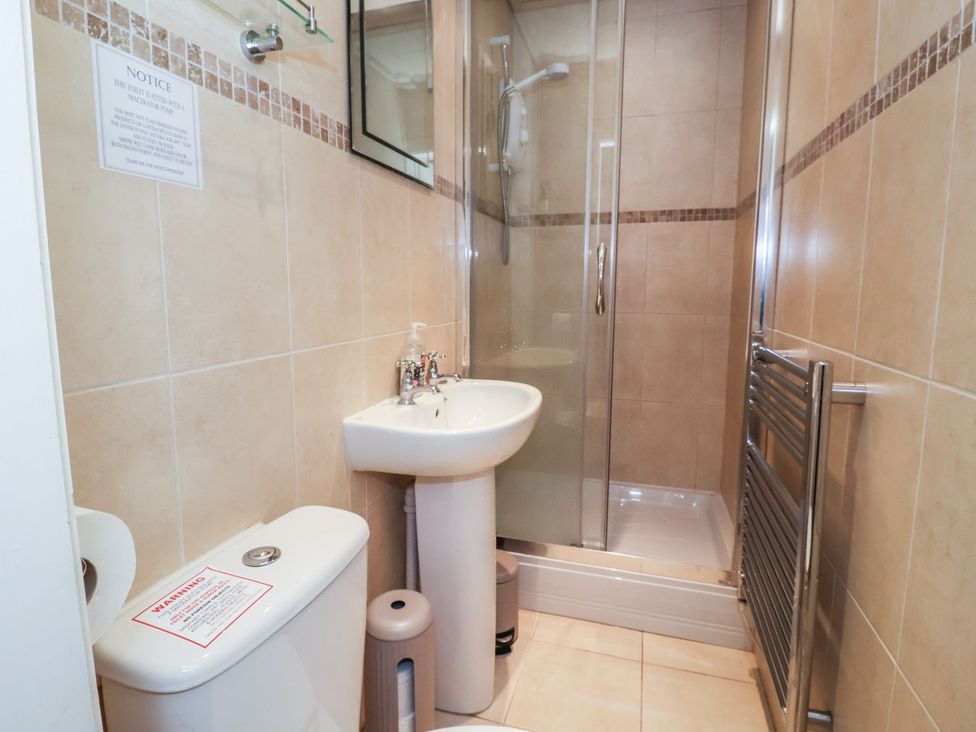 A bathroom with a shower and sink at Blacksmiths Mews in York