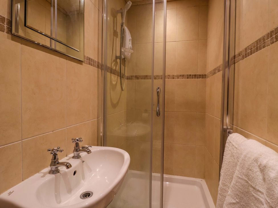 A bathroom with a sink and shower at Blacksmiths Retreat in York