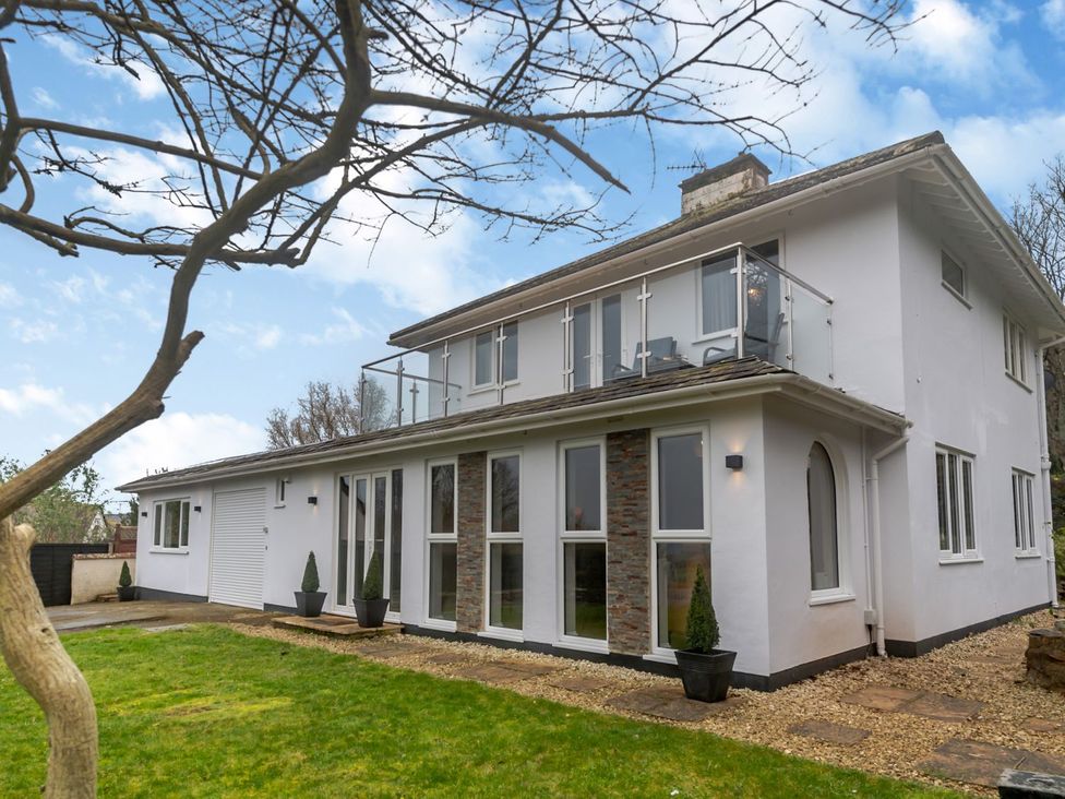 A house with a balcony and garden at Broadsands in Paignton