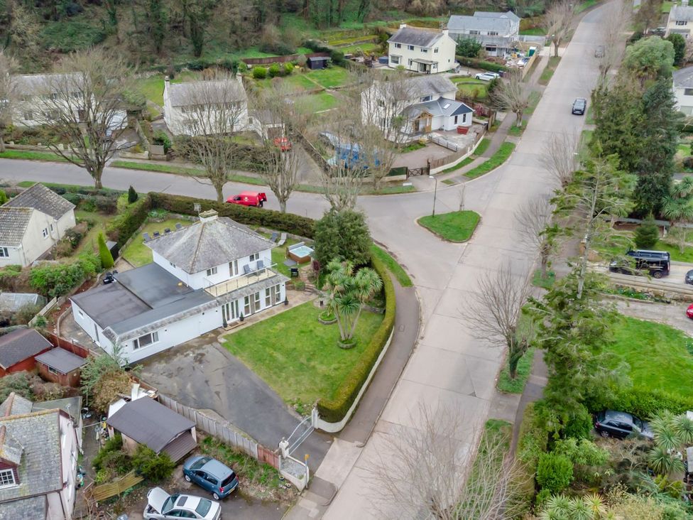 An aerial view of houses and a road at Broadsands in Paignton
